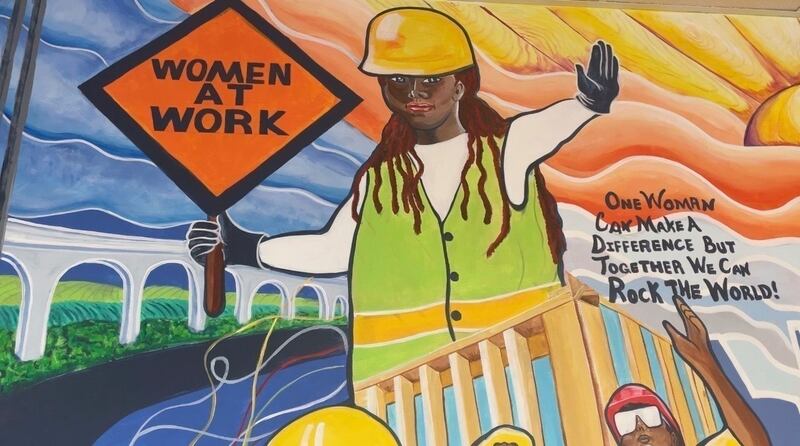FILE - A mural by artist Tene Smith is seen near the entrance of Chicago Women in Trades, a nonprofit dedicated to training and retaining women in the skilled construction trades is photographed April 1, 2025, at the facility in Chicago. (AP Photo/Claire Savage, File)