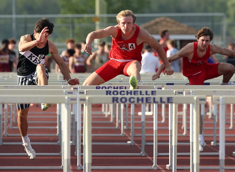 Ottawa’s Weston Averkamp (middle) clears a hurdle on his way to winning the 110 meter hurdles Tuesday, May 13, 2025, during the Interstate 8 Conference boys track championships at Rochelle High School.