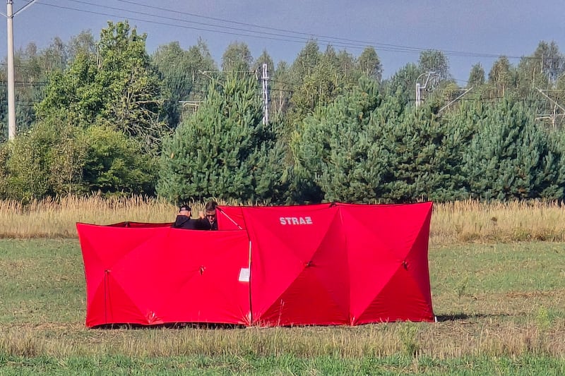 Firefighters secure parts of a damaged UAV shot down by Polish authorities at a site in Czosnowka near Biala Podlaska, Poland, Wednesday, Sept. 10, 2025. (AP Photo/Piotr Pyrkosz)