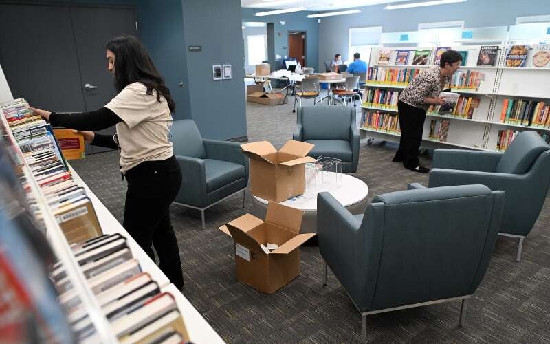 Books are stocked as final preparations are underway for the grand reopening of the South Elgin Branch of the Gail Borden Library. It's been closed for an expansion and renovation since August 2024.