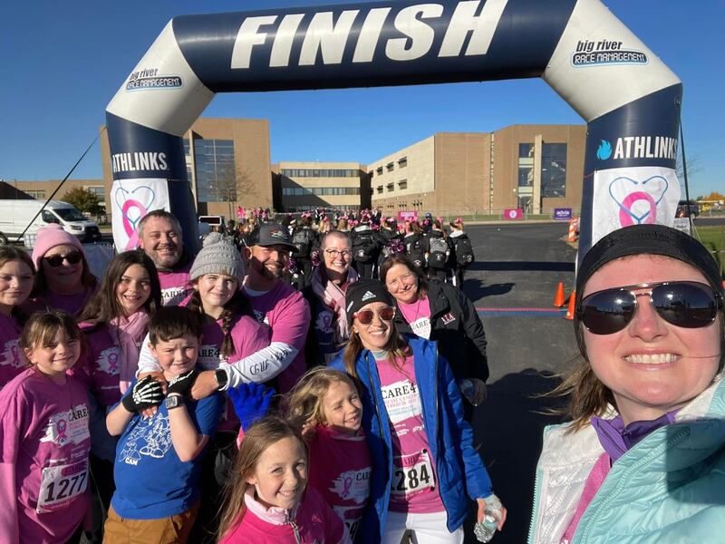 Maura Kirchner (back row, in glasses and scarf) and members of her family posed for a selfie at a past Care4 Breast Cancer 5K benefitting the Family Health Partnership Clinic. Taking the photo (front right) was Kirchner's daughter, Chrissy Christiansen.