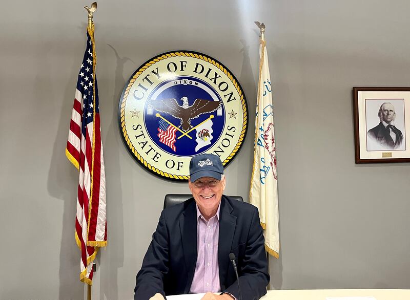 Dixon Mayor Glen Hughes sports a city of Rockford hat at Monday's city council meeting, June 2, 2025, after losing a bet made to support the high schools scholastic bowl team.