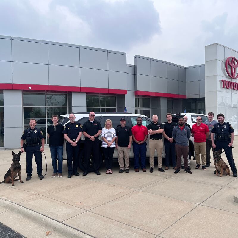 Sycamore Police Department officers, K9 Gibbs, and Brian Bemis Toyota of DeKalb employees