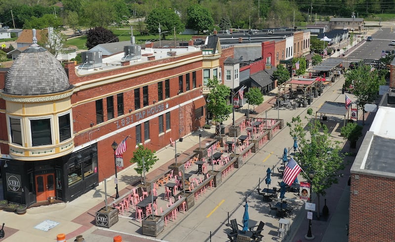 Utica businesses kicked off the outdoor dining season by setting up patio furniture, flowers, decorations and canopies on Thursday, May 8, 2025 for customers on Mill Street downtown Utica. The outdoor dining season on Mill Street runs through October.