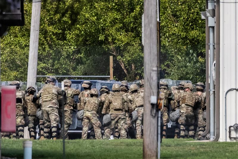 Soldiers participate in what seems to be a training exercise at the Joliet Local Training Area site for the Illinois National Guard at 20612 Arsenal Road in Elwood on Wednesday, Oct. 8, 2025.