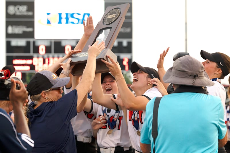 Lincoln-Way West raises the trophy in their win over Mundelein Saturday, June 6, 2026, in the class 4A state softball title game.