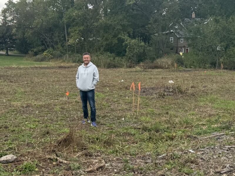 Dan Woodward of New Directions Addiction Recovery Services shows the property where the organization plans to build "three-quarter" sober living apartments in Woodstock.