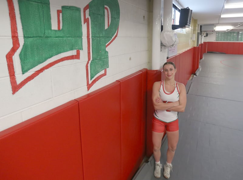 L-P's Kiely Domyancich poses for a photo on Thursday, March 12, 2026 in the wrestling room at L-P High School. Domyancich is the 2025-2026 female wrestler of the year.