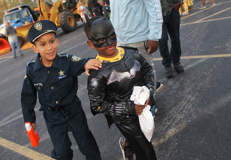 Malchom Trammell, 8, of Round Lake Beach and Kendrick Burns, 6, of Round Lake, dressed in their costumes, check out the Halloween Howl at the Village of Fox Lake Police Department.