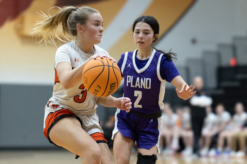 Plano's Lily Kozenko (2) guards Sandwich's Khloe White during Tuesday's game in Sandwich.