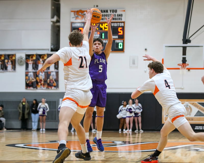 Plano's Eric Nunez (5) shoots a three point shot during their basketball game between Sandwich at Plano Tuesday, Jan 27, 2026 in Sandwich.