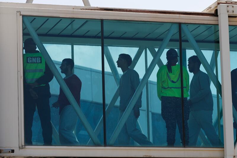 Venezuelan migrants deported from the United States arrive at Simon Bolivar International Airport in Maiquetia, Venezuela, Sunday, March 30, 2025. (AP Photo/Cristian Hernandez)