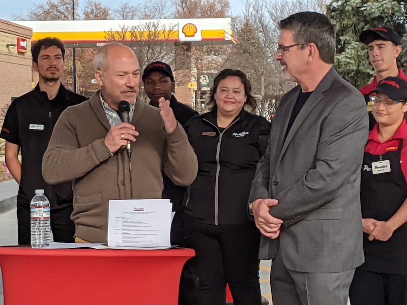 Plainfield Mayor John Argoudelis, left, addresses Portillo's Vice President of Restaurant Support Michael Portillo, right, during a ribbon-cutting ceremony at the new Portillo's restaurant at the corner of 135th Street and Route 59 on Nov. 24, 2025.