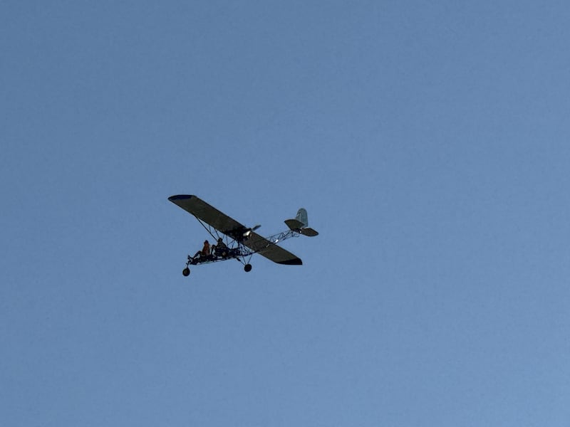 An open-engine airplane takes off from the Morris Municipal Airport flying over the Grundy County Fair on Thursday, July 3, 2025.