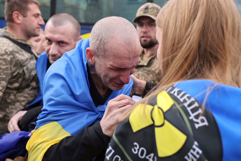 A Ukrainian soldier cries after returning from captivity following a POWs exchange between Russia and Ukraine, in Chernyhiv region, Ukraine, Sunday, Aug. 24, 2025. (AP Photo)