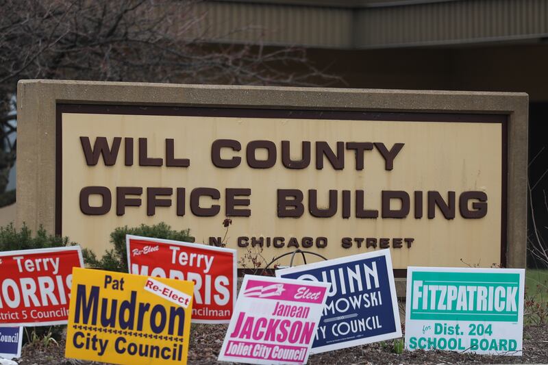 Candidate campaign lawn signs line the parking lot at the Will County Office Building, in Joliet. Will County Office Building was one of multiple locations open for early voting on Monday, April 3, 2023 in Joliet.