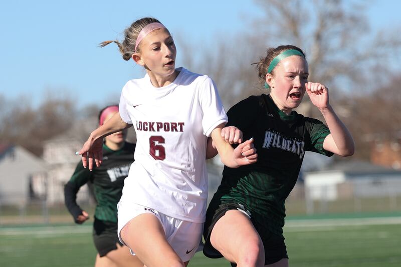 Lockport’s Ava Kozak battles Plainfield Central’s Selah Fornelli for a shot on Friday, April 5, 2024.