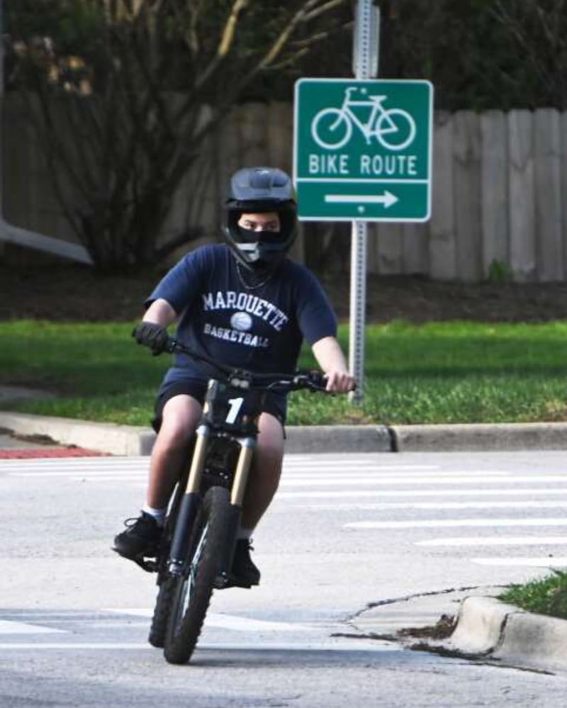 An e-moto rider travels along a section of the McHenry County Prairie Trail on Tuesday.