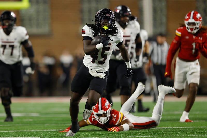 Northern Illinois RB Telly Johnson Jr. (45) runs for a 74-yard touchdown during the third quarter of an NCAA football game against Maryland on Friday, Sept. 5, 2025, in College Park, Md. Maryland won 20-9. (AP Photo/Mike Buscher)