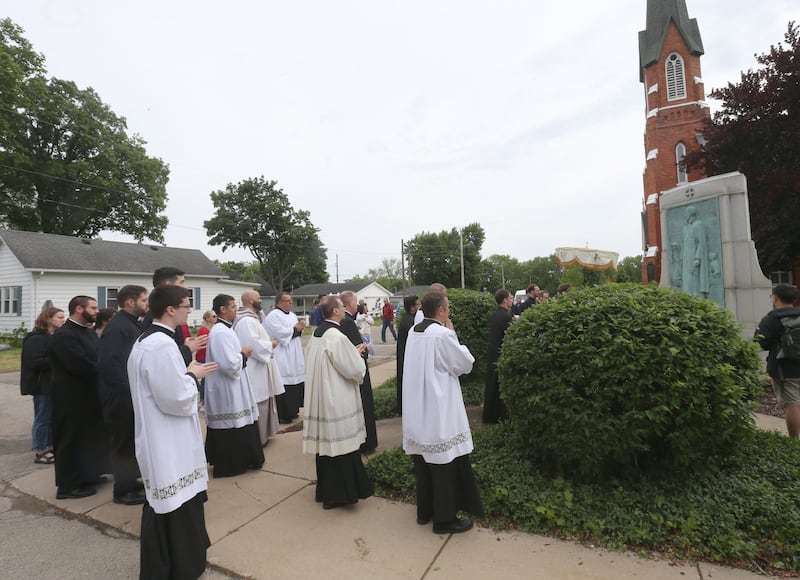 Bishop Louis Tylka leads a Eucharistic Pilgrimage on Monday, May 19, 2025 at the Father Marquette memorial outside St. Mary's Catholic Church in Utica. The Pilgrimage began in the Archdiocese of Indianapolis. The Pilgrimage also made stops at Seneca's St. Patrick Church Queen of the Holy Rosary Shrine and St. Hyacinth Church.