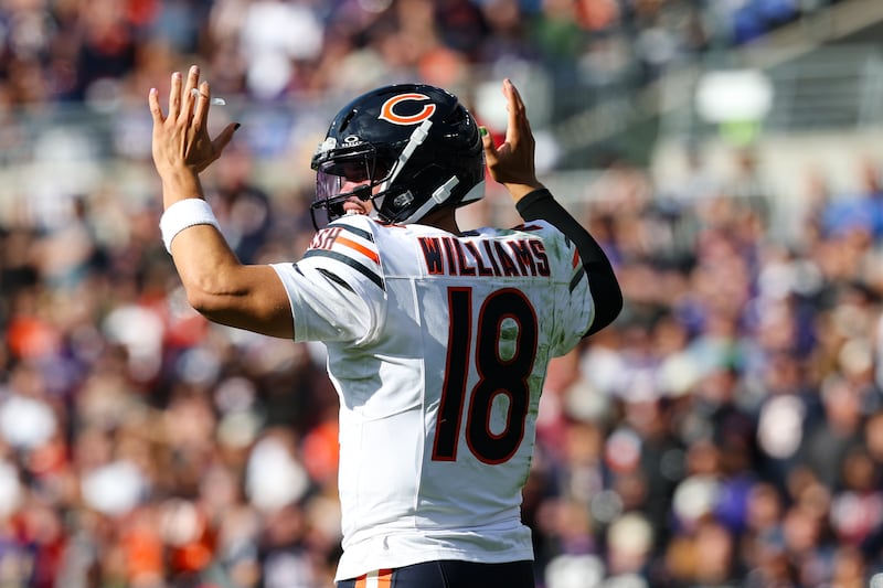 Chicago Bears quarterback Caleb Williams (18) signals for a touchdown after running back D'Andre Swift scores during the second half of an NFL football game against the Baltimore Ravens, Sunday, Oct. 26, 2025, in Baltimore. (AP Photo/Terrance Williams)