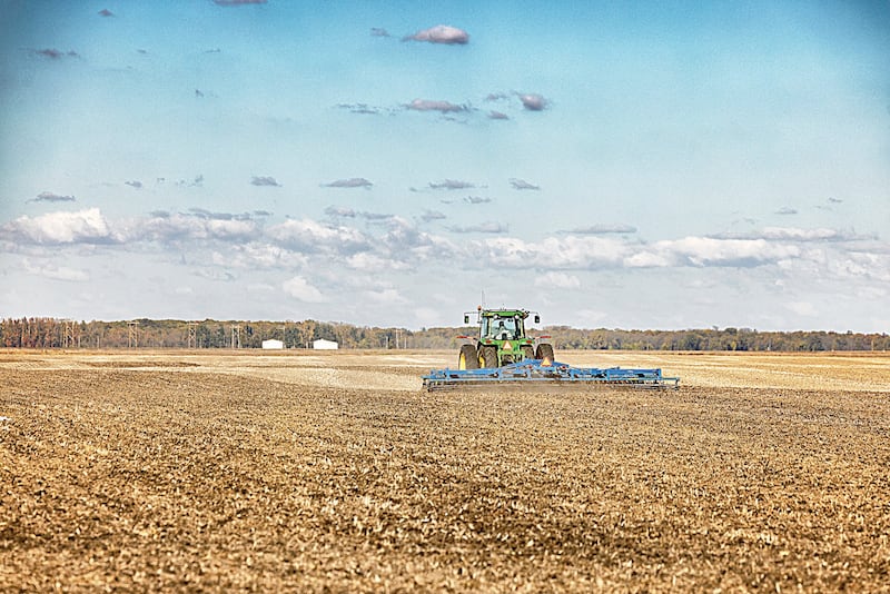 An Iroquois County farmer prepares a field after harvest for next season.