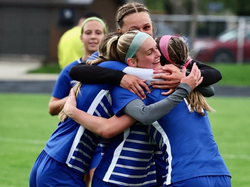 Princeton players celebrate a late first half-goal goal by Keeley Cardosi (center) Thursday night against L-P at Bryant Field. he Tigresses won 4-1.