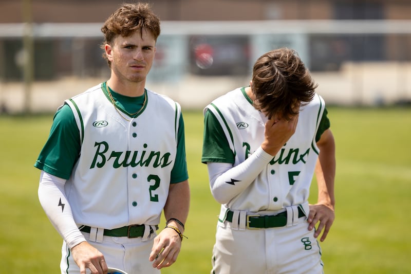 (2) Gus Burr of St. Bede walks with a distraught (5) Stuart McGunnigal on Saturday, May 24, 2025 at Stark County High School in Toulon.