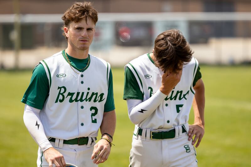 (2) Gus Burr of St. Bede walks with a distraught (5) Stuart McGunnigal on Saturday, May 24, 2025 at Stark County High School in Toulon.