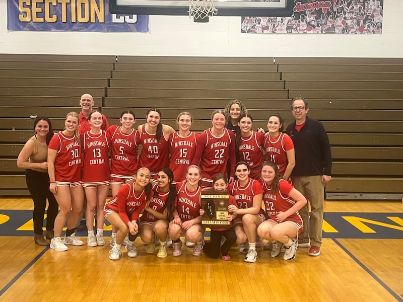 Hinsdale Central's girls basketball team poses after beating Kenwood in Thursday's Simeon Regional final.
