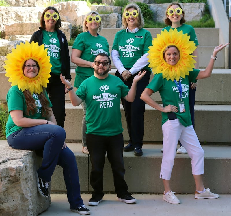 The St. Charles Public Library staff celebrating its 2026 summer reading challenge