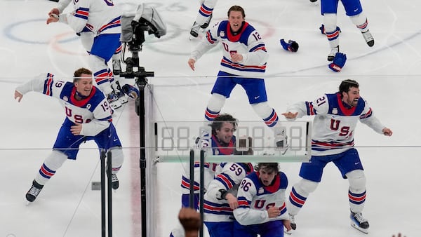 Jack Hughes scores in overtime as US beats Canada for first men’s hockey gold at the Olympics since 1980