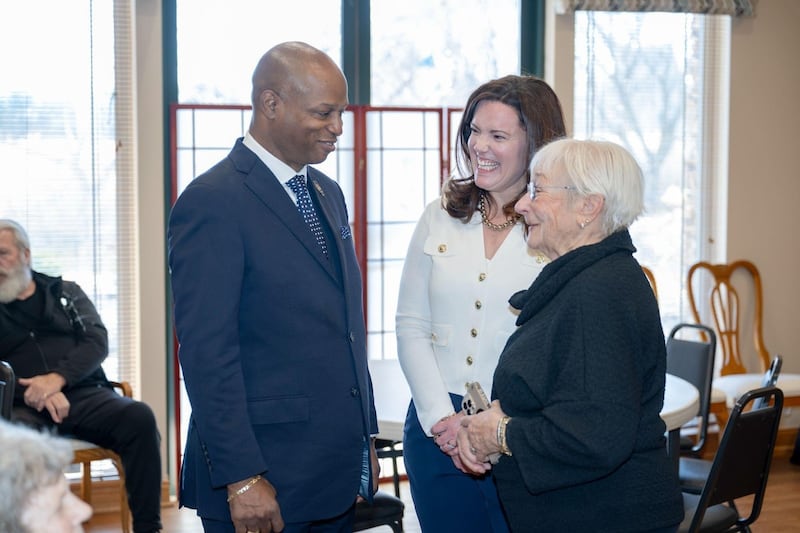 Speaker Chris Welch and Rep. Laura Faver Dias speak with seniors at Carillon North during the event.