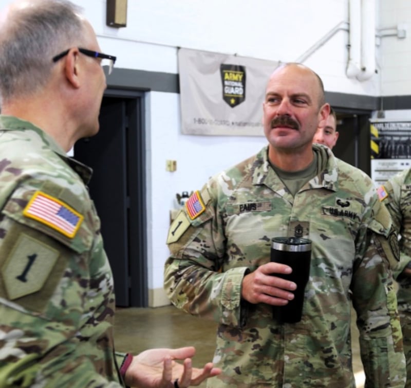 First Sergeant Aaron Paus, the first sergeant of Logistics Advisory Team 6612, talks with Brig. Gen. Michael Eastridge, the Deputy Assistant Adjutant General of the Illinois Army National Guard, following the unit’s welcome home ceremony on April 6 in Marseilles. The 6th Battalion, 54th Security Assistance Advisory Brigade’s LAT 6612 returned from a deployment to the Philippines. The welcome home ceremony was the last day of military duty for Paus, who retired after 23 years of service. Paus has deployed to Iraq twice, to Jordan, and to the Philippines in his 23 years of service. As a civilian, he works for Union Pacific Railroad as a foreman of a tie gang.
