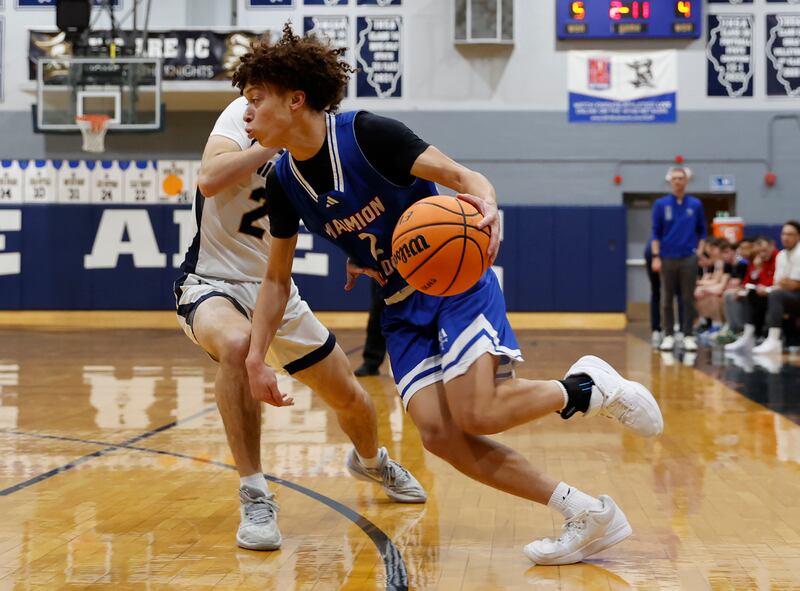 Marmion's Jamin Berman (2) drives to the basket during the boy's varsity basketball game between Marmion Academy and IC Catholic Prep on Friday, Jan. 30, 2026 in Elmhurst, IL.
