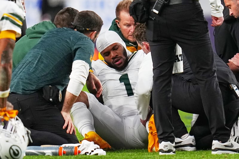 Green Bay Packers' Micah Parsons reacts after an injury during the second half of an NFL football game against the Denver Broncos Sunday, Dec. 14, 2025, in Denver. (AP Photo/Jack Dempsey)