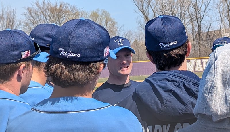Cary-Grove baseball coach Kyle Williams talks to his team in between innings during the Trojans' game against Wauconda on Saturday, April 12, 2025, in Wauconda.