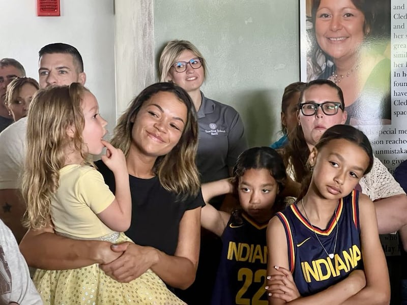 Sauk Valley Voices of Recovery Operations Manager Lauren Metzler stands with her children at the May 2025 ribboncutting for Cledy's House of Hope, a new women's sober living facility in Rock Falls.