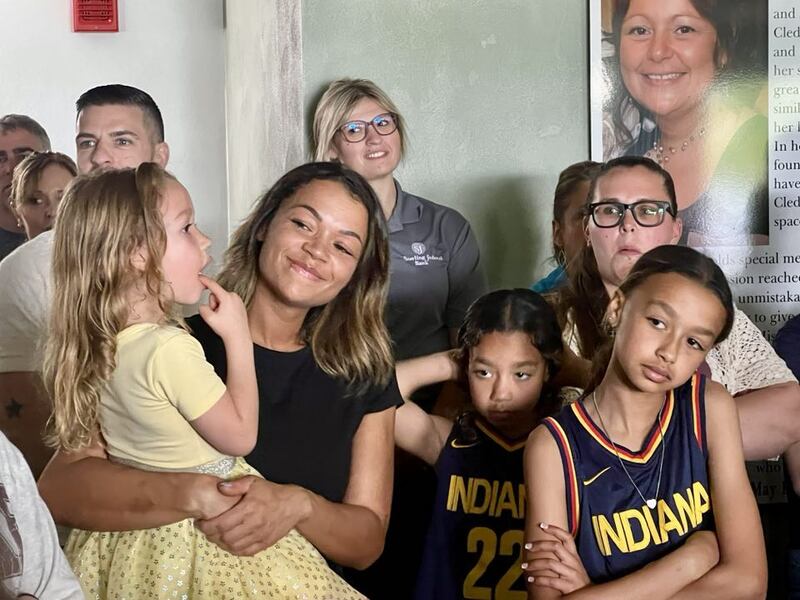 Sauk Valley Voices of Recovery Operations Manager Lauren Metzler stands with her children at the May 2025 ribboncutting for Cledy's House of Hope, a new women's sober living facility in Rock Falls.