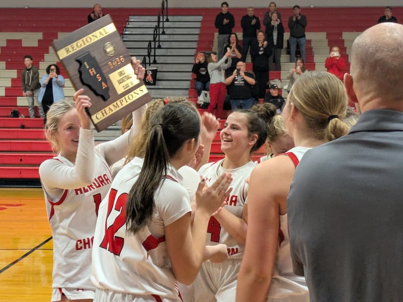 Aurora Christian players celebrate winning the Class 1A South Beloit Regional 31-29 against Indian Creek on Thursday, February 19, 2026.