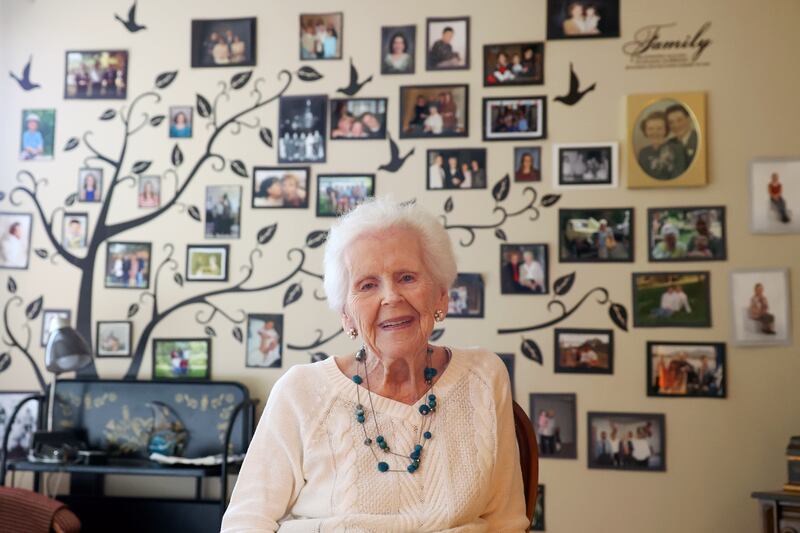 Eileen Dupuis, a longtime Bourbonnais resident, sits near a wall displaying her large family tree at her residence on Oct. 15, 2025, at Riverside's Westwood Oaks Independent Living community in Kankakee. Dupuis will celebrate her 105th birthday on Saturday, Oct.