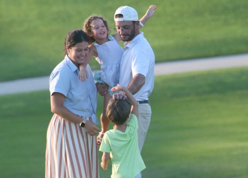 Jon Prescott hugs his wife Mary and kids Madeline and Charlie after winning the Illinois Valley Mens Golf Championship Tournament on Sunday, July 27, 2025 at Spring Creek Golf Course in Spring Valley.