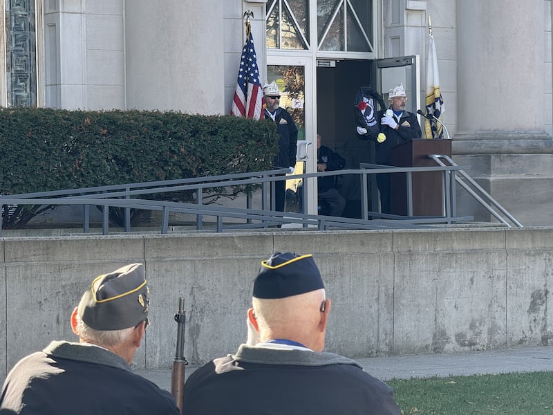 Jerry Terando presents the POW MIA wreath to the crowd at the Veterans Day ceremony on Monday.