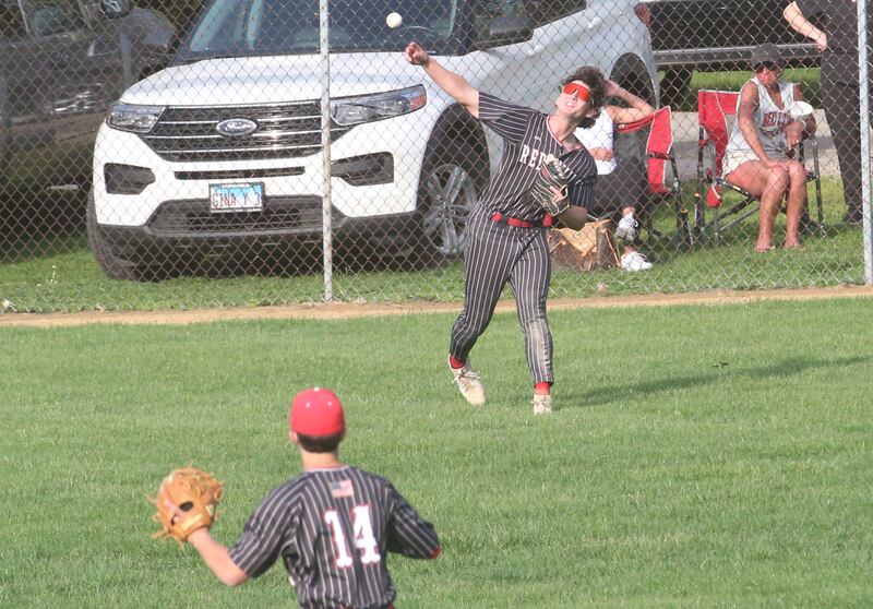 Hall's Jack Jablonski throws the ball to his cut-off man Geno Ferrari (14) after fielding a ball in the outfield against Erie-Prophetstown on Monday, April 28, 2025 in Foley Field at Kirby Park in Spring Valley.