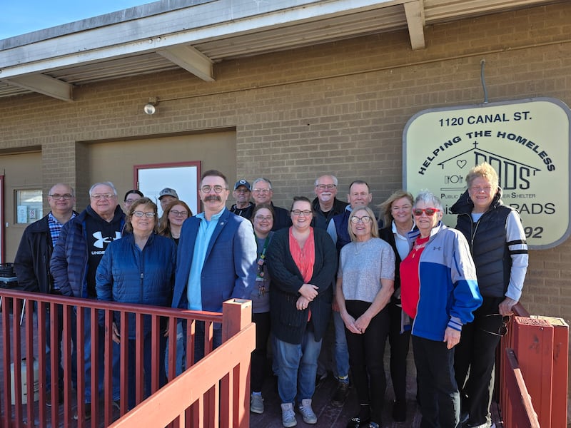 Ottawa city officials and Illinois Valley Public Action to Deliver Shelter volunteers and board members gathered Friday, Feb. 28, 2025, to celebrate a $2 million grant award that will move construction forward of a new facility. Pictured are (front from left) Left to right Kevin Lindeman at North Central Illinois Council of Governments; Ottawa Commissioner Wayne Eichelkraut Jr.; Carol Alcorn, PADS executive director; Ottawa Mayor Robb Hasty, Brittney Smith, Marissa Trumper, Sue Koeppe, Pat Applebee (back from left) Carrie Fuchs, Ariana Margis, Bob Hylin, Bob Piercy, Dave Nobel, Ken Brown, Tom Rooney, Gerilyn Westerman and Joanne Sheldon.