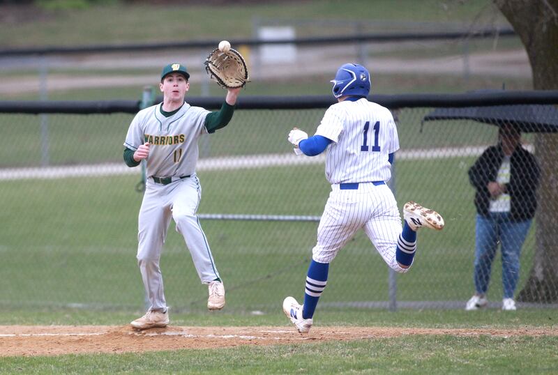 Waubonsie Valley's Noah Pilon makes a catch at first as Geneva's Michael Toole runs in during a game on Wednesday, April 9, 2025 in Geneva.