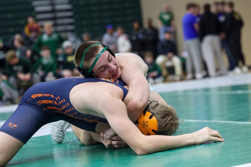 Coal City's Aiden Kenney, top, wrestles Pontiac's Brayden Quas in the 157-pound championship match during the IHSA Class 1A Coal City Sectional on Saturday, Feb. 14, 2026.