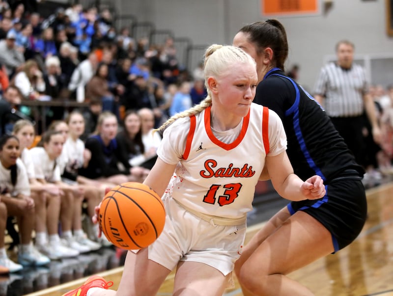 St. Charles East's Addie Schilb drives toward the basket during a game against St. Charles North on Friday, Jan. 31, 2025 at St. Charles East.