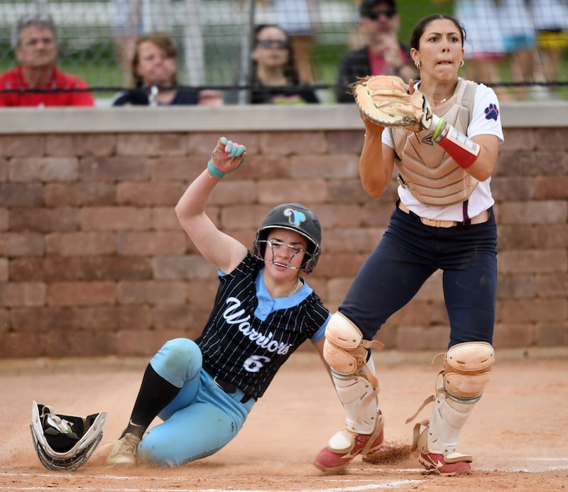Willowbrook’s Marli Smrz is forced out at home by Conant catcher Sophia Gomez during the Class 4A Conant softball regional in Hoffman Estates Tuesday.