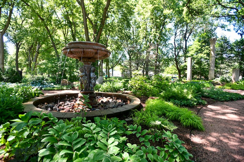 Lush green foliage thrives in the historic Column Garden at Governor Small Memorial Park on Thursday during the Kankakee Kultivators Garden Club annual Garden Tour & Artisan Faire held at the Kankakee County Museum. The Kultivators maintain the Column Garden as well as the Let Freedom Ring Garden on the museum grounds.